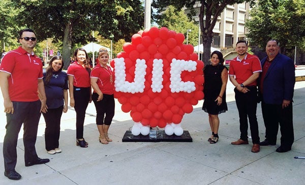 Students with UIC logo